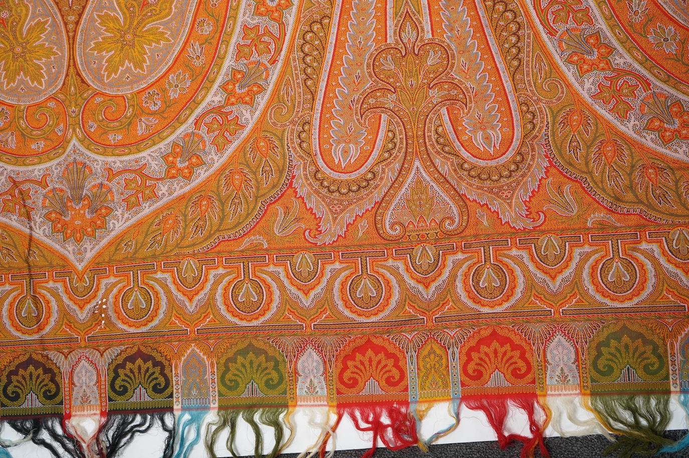 A French possibly Lyon, 19th century ornate silk and fine wool woven Paisley patterned shawl. Woven in polychromes coloured silks and wools on a jacquard loom, using an array of punch cards to create this elaborate desig
